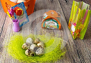 Colored different Easter eggs table decoration with postcard `Happy Easter`