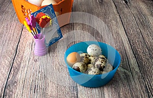 Colored different Easter eggs table decoration with postcard `Happy Easter`