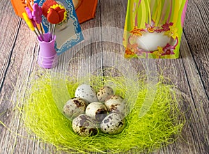 Colored different Easter eggs table decoration with postcard