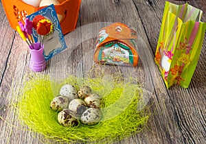 Colored different Easter eggs table decoration with postcard