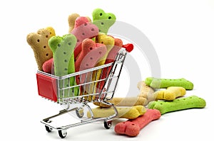 Colored dog biscuits and shopping cart