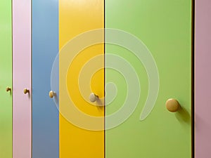 Colored doors of children wardrobes for clothes in the kindergarten