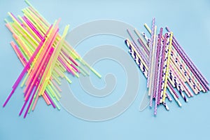 Colored drinking straws on a blue background