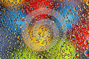 Colored drops of water on glass. abstract background texture