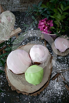 Colored Easter cakes with a rim on a plate. Easter