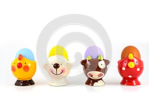 Colored easter egg in fancy cup