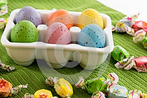 Colored Easter eggs, candy and decorations