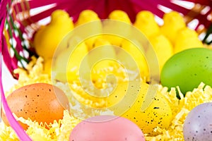 Colored Easter eggs, chicks and basket