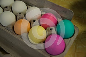 Colored Easter eggs in egg carton for easter egg hunt