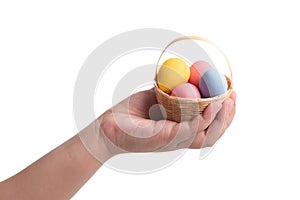 Colored easter eggs with kid hand isolated on white
