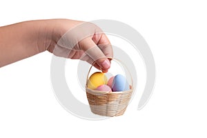 Colored easter eggs with kid hand isolated on white