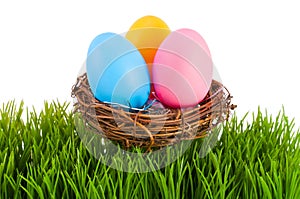 Colored Easter eggs in a nest.