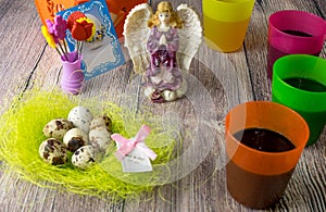 Colored Easter eggs table decoration with angel