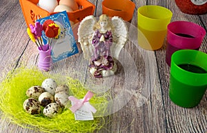 Colored Easter eggs table decoration with angel