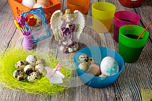 Colored Easter eggs table decoration with angel