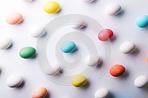 Colored eggs flat lay on a white background. Easter and spring composition.