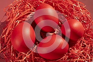 Colored eggs symbolize Easter in shades of red