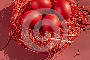 Colored eggs symbolize Easter in shades of red