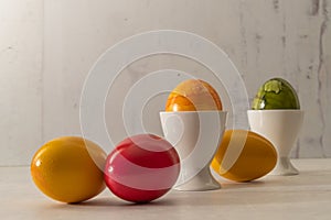 colored eggs on table or in egg cup