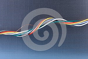 Colored electrical cable on metallic background