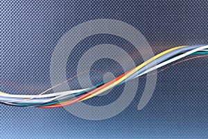 Colored electrical cable on metallic background