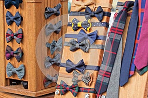 colored fabric bow ties on a brown display case