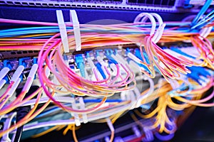 Colored fiber optic cables held together with zip ties