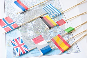 Colored flags of Europian countries on a map: France, Italy, England UK, Spain, Greece, travel destination planning concept
