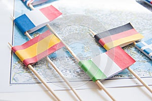 Colored flags of Europian countries on a map: France, Italy, England UK, Spain, Greece, travel destination planning concept