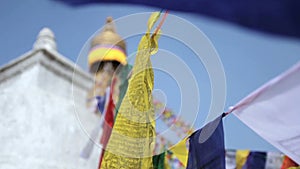 Colored flags fly near Boudha Bouddhanath or Baudhanath stupa in Nepal