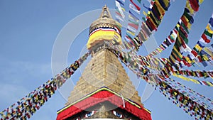 Colored flags fly near Boudha Bouddhanath or Baudhanath stupa in Nepal