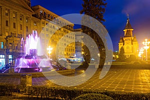 Colored fountain on Victoriei Square with Orthodox Cathedral