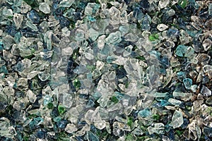 Colored glass pieces with a sharp edges. Abstract broken glass background