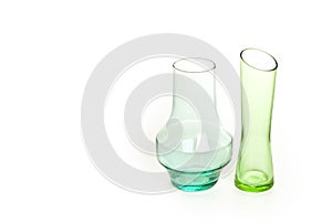 Colored glass vases on a white background