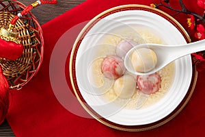 Colored glaze style big tangyuan with sweet rice wine soup and egg drop