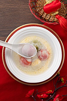 Colored glaze style big tangyuan with sweet rice wine soup and egg drop