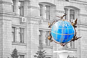 Colored globe over facade administrative house photo