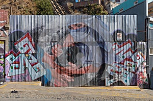 Colored graffiti, street art on the walls of Valparaiso, Chile