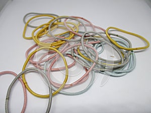 colored hair ties can be used by men or women on a white background