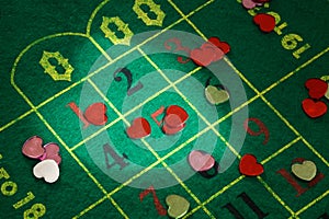 Colored hearts on the roulette cloth