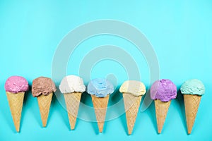 Colored ice cream cones flat lay with copy space photo