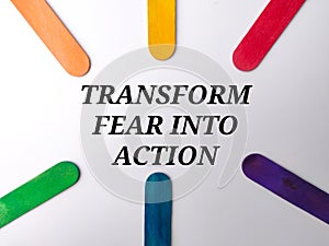 Colored ice cream stick with text TRANSFORM FEAR INTO ACTION