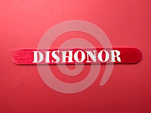 Colored ice cream stick with the word DISHONOR