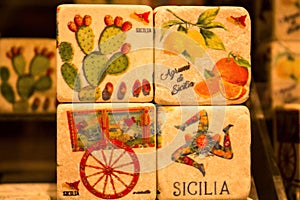 Colored images reproduced on cube-shaped stones promoting the Sicily region in Italy photo