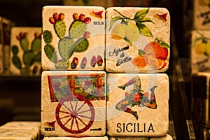 A promozione della regione Sicilia in Italia  colored images reproduced on cube-shaped stones promoting the Sicily region in Italy