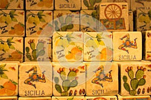 Colored images reproduced on cube-shaped stones promoting the Sicily region in Italy photo