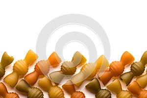 Colored italian pasta isolate on white background. Flat lay top view with space for copy. Close-up