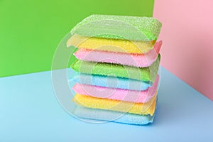 Colored kitchen sponges on colorful background. Kitchen cleaning set