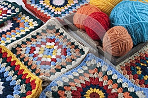 Colored knitting threads in a wooden box