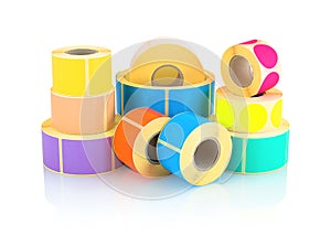 Colored label rolls on white background with shadow reflection. Color reels of labels for printers.